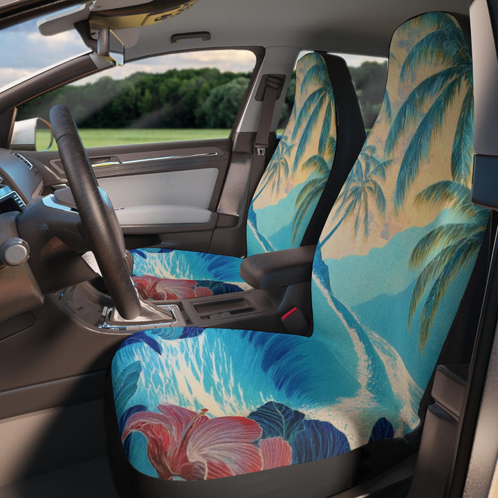 the interior of a car with a colorful, tropical-themed seat cover featuring palm trees and flowers.