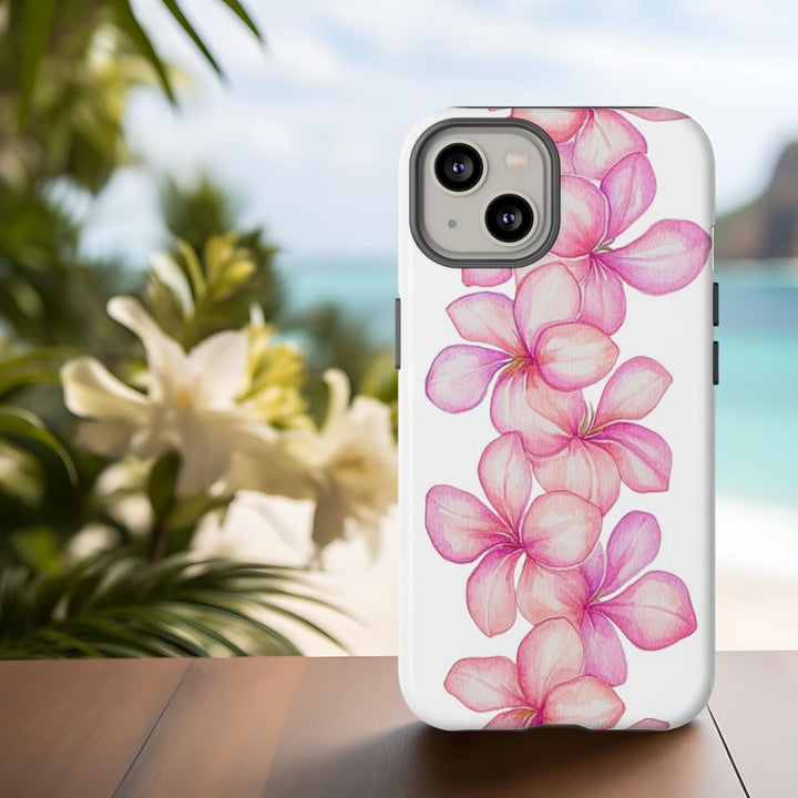 A white phone case with a floral pattern of an abstract pink plumeria lei