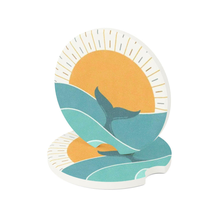 A round car coaster with a sun and ocean design, featuring a blue and orange color scheme.