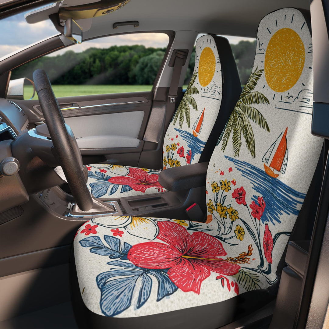 the interior of a car with two colorful seat covers featuring tropical designs, including a hibiscus flower, palm trees, and a sailboat.