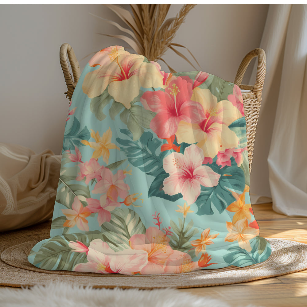 a large bed covered in a colorful Hawaiian floral comforter.