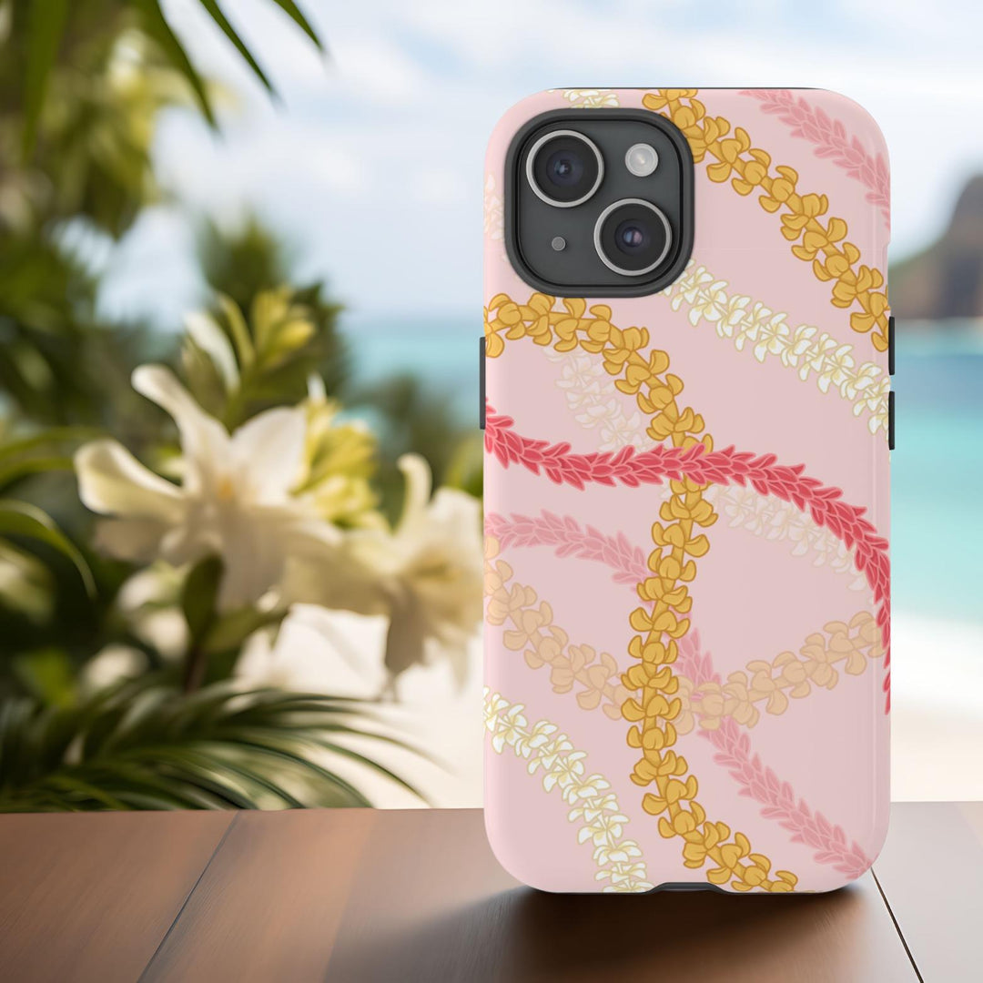 A pink phone case with a tropical flower lei floral pattern