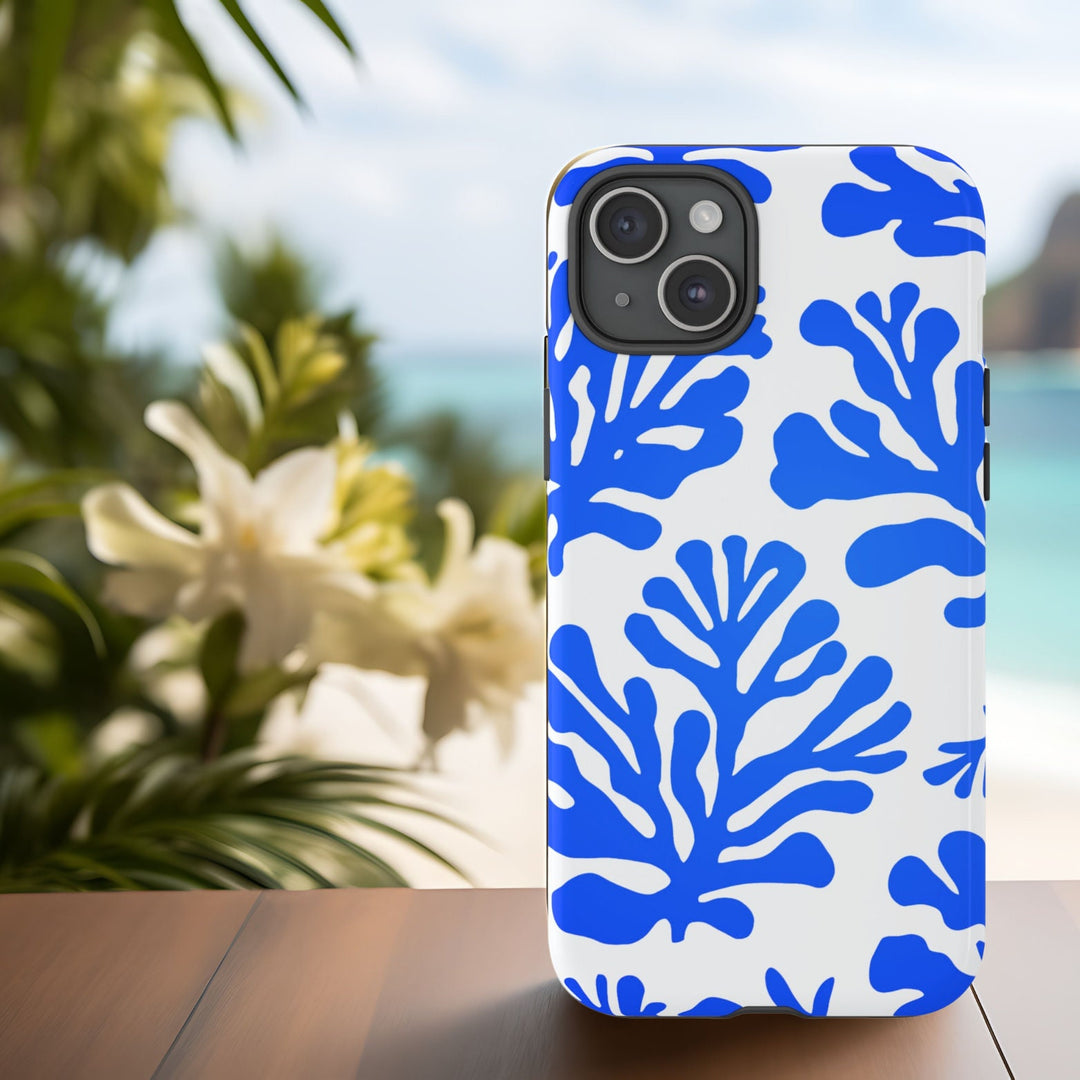 A white and blue patterned phone case with blue abstract modern coral design