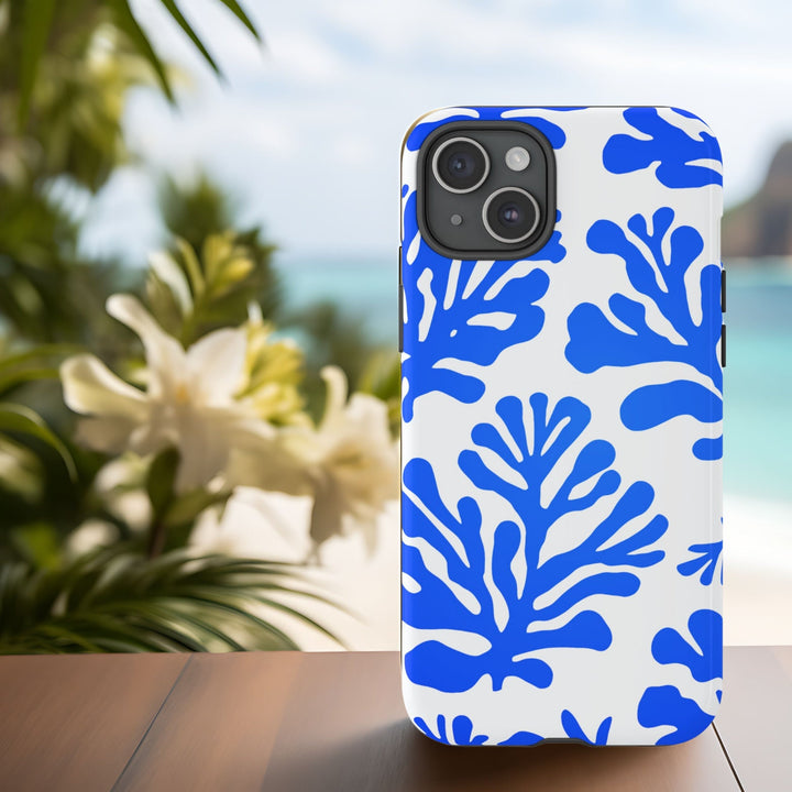 A white and blue patterned phone case with blue abstract modern coral design