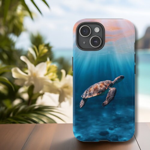 a phone case with a picture of a turtle swimming in the ocean