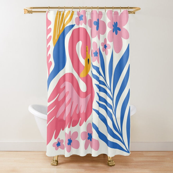 A colorful shower curtain with a pink flamingo and blue palm leaves design,