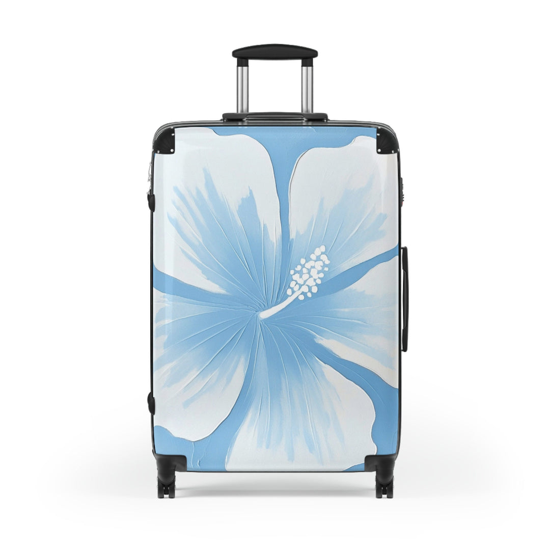 A blue and white suitcase with a hibiscus flower design