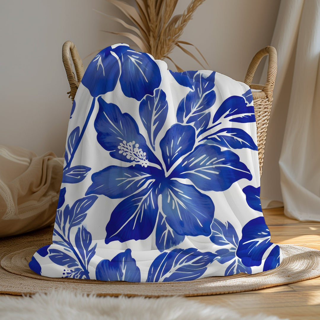 a large blanket with a blue and white floral print on a white background