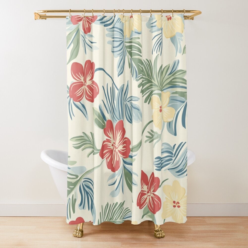 A shower curtain with a tropical floral pattern in shades of green, blue, and red.